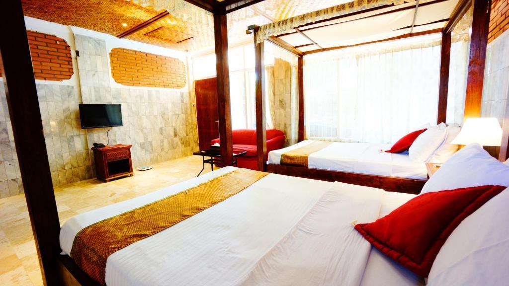 Puri Wisata Balinese Style Hotel Семиньяк Номер фото
